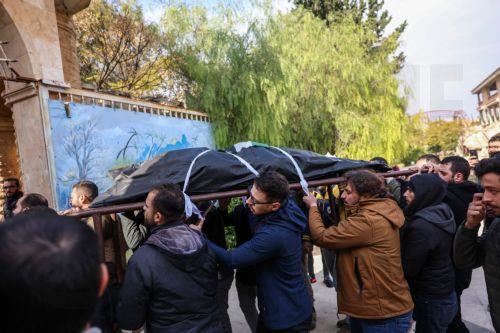 epa11756392 People carry the body of Syrian photojournalist Anas al-Kharboutli, who was killed in an airstrike, during his funeral procession in Idlib, Syria, 04 December 2024. Al-Kharboutli was killed on 04 December in an airstrike on Murk city, Hama countryside, while covering the ongoing fighting between opposition and government forces, according to the...