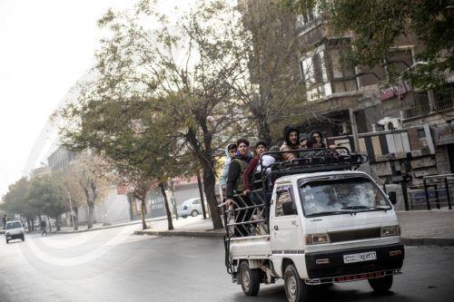 epa11764157 People ride on the back of a vehicle as people celebrate after Syrian rebels captured the city of Damascus, in Damascus, Syria, 08 December 2024. Syrian rebels entered Damascus on 08 December 2024 and announced in a televised statement the 'Liberation of the city of Damascus and the overthrow of Bashar al-Assad', as well as the release of all...