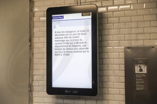 epa11790820 A screens shows a message announcing a minute of silence during a day of national mourning for the lives lost after a cyclone hit the Indian Ocean territory of Mayotte, at the metro in Paris, France, 23 December 2024. The French president declared 23 December a national day of mourning to pay tribute to the victims of cyclone Chido, which...