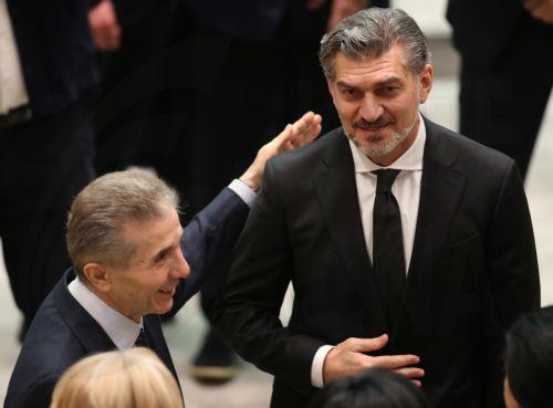 epa11797086 Founder of the Georgian Dream party, Bidzina Ivanishvili (L), greets Georgian President-elect Mikheil Kavelashvili before the swearing-in ceremony at the parliament in Tbilisi, Georgia, 29 December 2024. Georgian lawmakers elected Kavelashvili as the country's new president on 14 December in a controversial parliamentary vote that sparked...