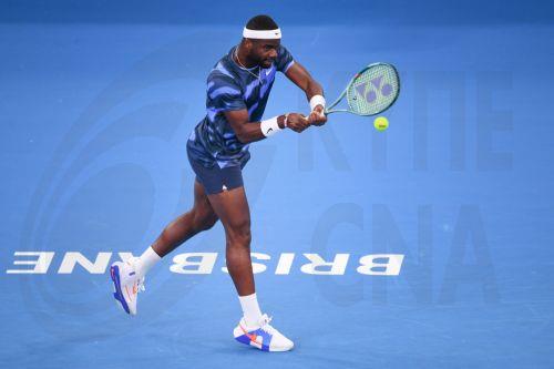 epa11801917 Frances Tiafoe of the USA in action against Giovanni Mpetshi Perricard of France during their men's singles round of 16 match of the Brisbane International tennis tournament at Queensland Tennis Centre in Brisbane, Australia, 02 January 2025.Â   EPA/JONO SEARLE AUSTRALIA AND NEW ZEALAND OUT