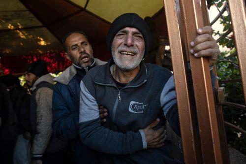 epa11801982 A Palestinian man mourns for relatives who were killed during an Israeli airstrike on an internally displaced persons camp in Al-Mawasi area, west of Khan Yunis, southern Gaza Strip, 02 January 2025. Ten Palestinians were killed in the airstrike, according to the local Nasser Hospital. According to the UN, at least 1.9 million people (or nine in...