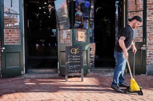 epa11802790 Andy Bergenon cleans the front of his bar Oz as Bourbon Street is reopened to the public in New Orleans, Louisiana, USA, 02 January 2025. At least 15 people are dead and 35 injured after the driver of a white pickup truck slammed into a crowd of people on Bourbon Street on 01 January 2025 and then opened fire with a gun. The FBI identified the...