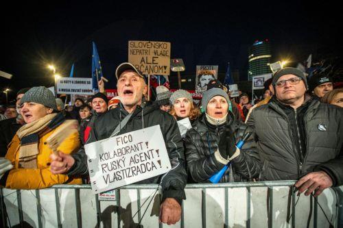 epa11817196 A man shouts slogans and holds a placard reading 'Fico collaborator! Russian agent!' during a demonstration against the Slovak prime minister, in front of the Government Office building, in Bratislava, Slovakia, 10 January 2025. The protests, titled 'Slovakia is Europe- Enough of Russia!', were sparked by Prime Minister Robert Fico's meeting...