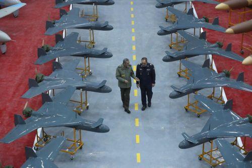 epa11821633 A handout picture made available by the Iranian army office shows Commander-in-Chief of Iran's Army, Abdolrahim Mousavi (L), and Iranian Defense Minister Aziz Nasirzadeh (R) inspecting the drones during an inauguration ceremony of 1000 new drones joining the Iranian Army in Tehran, Iran, 13 January 2025.  EPA/HANDOUT HANDOUT EDITORIAL USE...