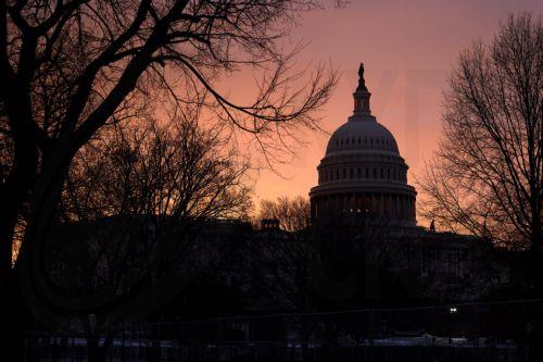 epa11831669 The US Capitol is pictured as the sun rises in Washington, DC, USA, 17 January 2025. US President-elect Donald Trump announced his inauguration will be moved indoors due to dangerously cold temperatures projected in the nation's capital.  EPA/ALLISON DINNER