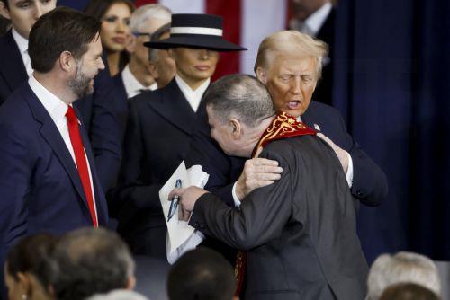 epa11839632 Rev. Father Frank Mann (R) of the Roman Catholic Diocese of Brooklyn with US President Donald Trump (L) after delivering a benediction during Trumpâ€™s inauguration ceremony in the rotunda of the United States Capitol in Washington, DC, USA, 20 January 2025. Trump, who defeated Kamala Harris, is being sworn in today as the 47th president of the...