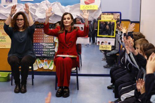 epa11847322 Spain's Queen Letizia participates in one of the kid's activities while visiting the 'Cortes de Cadiz' school in Madrid, Spain, 23 January 2025. Queen Letizia learned on 23 January about the pioneering socio-emotional education project 'Think Equal' for children from 3 to 6 years old and already implemented in 34 schools, with which, through...