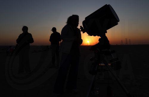 epa11855409 People gather to watch a planetary alignment, at a desert outside Dubai, United Arab Emirates, 26 January 2025. The Dubai Astronomy Group organized a gathering to witness the alignment of six Solar System planets, an astronomical event also known as a 'planetary parade'. The alignment of Mars, Jupiter, Uranus, Neptune, Venus, and Saturn started...