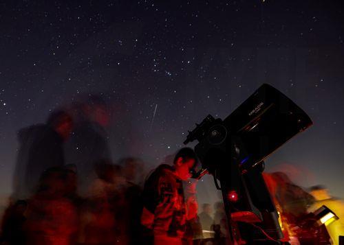 epa11855411 People gather to watch a planetary alignment, at a desert outside Dubai, United Arab Emirates, 26 January 2025. The Dubai Astronomy Group organized a gathering to witness the alignment of six Solar System planets, an astronomical event also known as a 'planetary parade'. The alignment of Mars, Jupiter, Uranus, Neptune, Venus, and Saturn started...