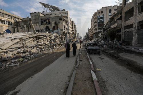 epa11858944 Palestinians walk in the streets of Gaza City amid a ceasefire between Israel and Hamas, Gaza Strip, 28 January 2025. Israel and Hamas implemented the first phase of a hostage release and ceasefire deal on 19 January 2025. More than 46,000 Palestinians have been killed in the Gaza Strip, according to the Palestinian Ministry of Health, since...