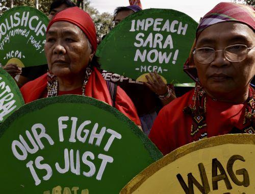 epa11865596 Protesters hold signs calling for the impeachment of Philippine Vice President Sara Duterte during a rally in Manila, Philippines, 31 January 2025. Duterte is facing three impeachment complaints filed at the House of Representatives in Congress, based on alleged cases of corruption, betrayal of public trust and malversation of public funds. ...