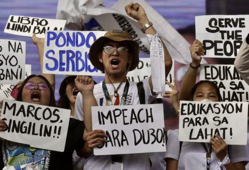 epa11865597 Protesters hold signs calling for the impeachment of Philippine Vice President Sara Duterte during a rally in Manila, Philippines, 31 January 2025. Duterte is facing three impeachment complaints filed at the House of Representatives in Congress, based on alleged cases of corruption, betrayal of public trust and malversation of public funds. ...