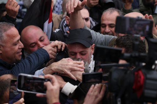 epa11882370 A released Palestinian prisoner is welcomed upon arrival to Ramallah in the West Bank, 08 February 2025. Israel has returned Palestinian prisoners following the release of three Israeli hostages, Eli Sharabi, Ohad Ben Ami and Or Levy, as part of the ongoing Israeli-Hamas hostage release and ceasefire deal.  EPA/ALAA BADARNEH