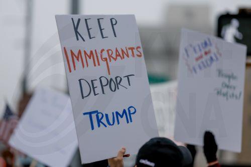 epa11899567 Demonstrators participate in a pro-democracy protest against recent Trump administration policies and actions outside the Georgia State Capitol in downtown Atlanta, Georgia, USA, 15 February 2025. The small group marched and chanted against US President Trump, Elon Musk, government worker firings, and mass immigration deportations.  EPA/ERIK S....