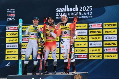 epa11900657 (L-R) Silver medalist Atle Lie McGrath of Norway, gold medalist Loic Meillard of Switzerland, and bronze medallist Linus Strasser of Germany pose on the podium after the Men's Slalom at the FIS Alpine Skiing World Championships in Saalbach Hinterglemm, Austria, 16 February 2025.  EPA/ANNA SZILAGYI