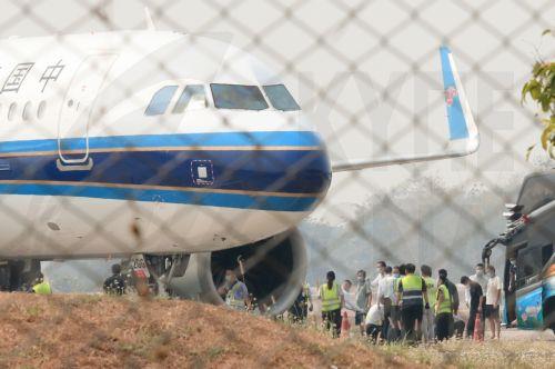 epa11909007 Chinese victims who were rescued from illegal call center scammer operations in Myanmar board a China Southern Airlines aircraft during a repatriation at the Mae Sot Airport on the Thai-Myanmar border in Mae Sot district, Tak province, Thailand, 20 February 2025. About 200 Chinese nationals were flown back to China after being rescued from call...