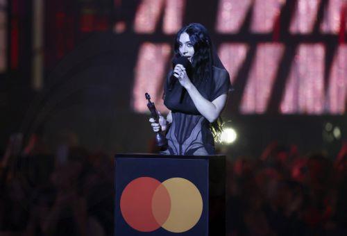 epa11933631 British singer Charlie XCX accepts the Song of the Year award during the 2025 BRIT Awards ceremony at The O2 arena in London, Britain, 01 March 2025. The annual pop music awards are presented by the British Phonographic Industry (BPI).  EPA/NEIL HALL
