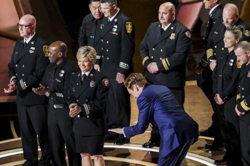 epa11937071 Conan Oâ€™Brien on stage with members of the Los Angeles Fire Department to honor first responders for fighting the recent wildfires in Los Angeles during the 97th annual Academy Awards ceremony at the Dolby Theatre in the Hollywood neighborhood of Los Angeles, California, USA, 02 March 2025.  EPA/ALLISON DINNER