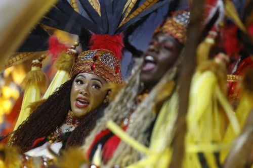 epa11941498 Members of Paraiso do Tuiuti samba school participate in the third day of parades at the Marques de Sapucai Sambodromo in Rio de Janeiro, Brazil, 04 March 2025.  EPA/Antonio Lacerda