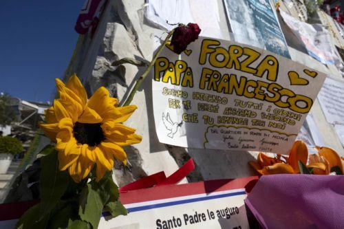 epa11947147 Messages of support for Pope Francis are displayed on the statue of Pope John Paul II outside the Gemelli University Hospital, where Pope Francis is hospitalized, in Rome, Italy, 07 March 2025. The pontiff was admitted to Rome's Gemelli Hospital on 14 February, due to a respiratory tract infection.  EPA/MASSIMO PERCOSSI