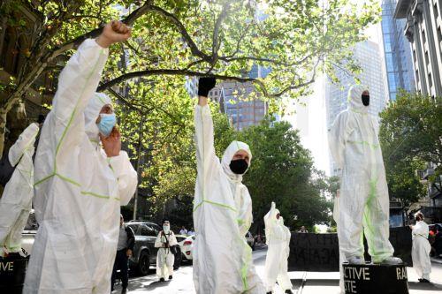 epa11957536 Anti-nuclear activists stage a protest outside mining company BHP headquarters in Melbourne, Australia, 12 March 2025.  EPA/JOEL CARRETT AUSTRALIA AND NEW ZEALAND OUT