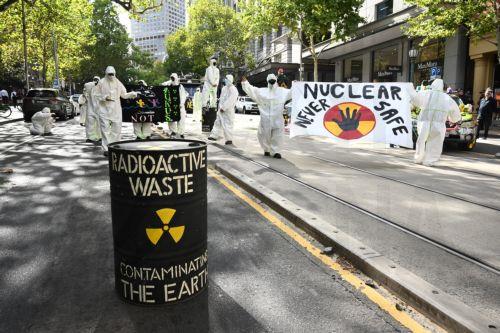 epa11957540 Anti-nuclear activists stage a protest outside mining company BHP headquarters in Melbourne, Australia, 12 March 2025.  EPA/JOEL CARRETT AUSTRALIA AND NEW ZEALAND OUT