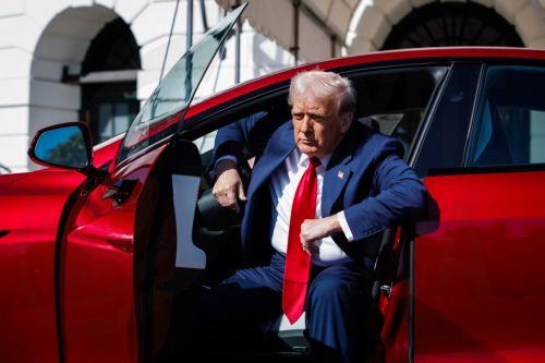 epaselect epa11957123 US President Donald Trump climbs out of a Tesla Model S on the South Lawn of the White House in Washington, D.C., USA, 11 March 2025. President Trump has said he will buy a Tesla to support Tesla and Elon Musk after recent attacks on Tesla charging stations and calls for boycotts of Tesla products.  EPA/SAMUEL CORUM / POOL