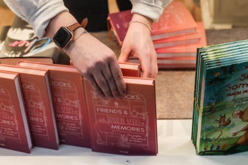 epa11989624 A worker prepares a bookstand one day ahead of the Leipzig Book Fair in Leipzig, Germany, 26 March 2025. Around 3000 exhibitors and 250,000 visitors are expected to attend the fair, which will run from 27 to 30 March. This year's guest of honor is Norway.  EPA/FILIP SINGER