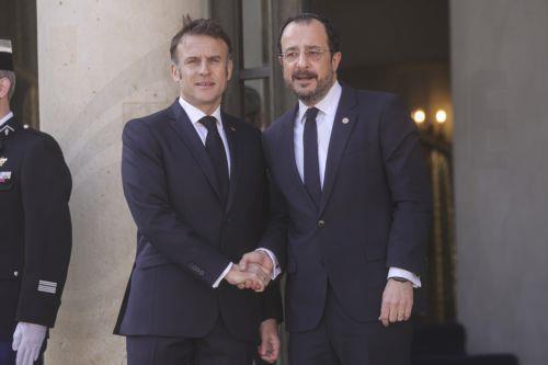 epa11991327 French President Emmanuel Macron (L) greets Cyprus President Nikos Christodoulides (R) upon his arrival for the 'Coalition of the Willing' summit on peace and security for Ukraine, with European and international leaders, at the Elysee Palace in Paris, France, 27 March 2025.  EPA/Teresa Suarez