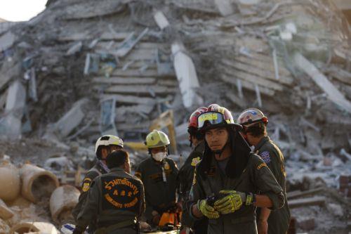 epa11994302 Rescue workers search for survivors at the site of a collapsed building following an earthquake in Bangkok, Thailand, 28 March 2025. According to the National Institute for Emergency Medicine, 70 construction workers are missing at the site following a 7.7-magnitude earthquake that struck Myanmar and caused tremors that could be felt in...