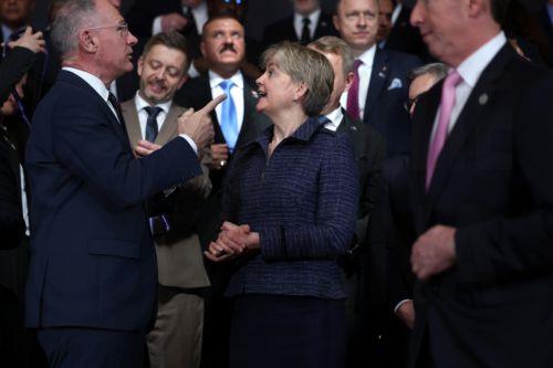 epa12001362 British Secretary of State for the Home Department Yvette Cooper (C) skeaks with delegates ahead of the family photo at the Border Security Summit at Lancaster House in London, Britain, 31 March 2025. The summit is bringing together over 40 countries to work on a new approach to dismantle people smuggling gangs and secure borders.  EPA/NEIL HALL...