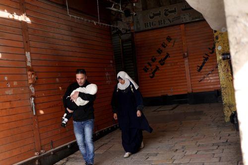epa12015158 Palestinians walk in the alleys of the old city of Jerusalem, 07 April 2025, during a general strike in the Palestinian territories in solidarity with Gaza. More than 50,500 Palestinians have been killed in the Gaza Strip, according to the Palestinian Ministry of Health, since Israel launched a military campaign in the strip in response to a...