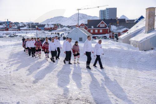 epa12015738 Head of the government Jens-Frederik Nielsen of Demokraatit party (front L) walks in the procession from Hans Egede house to Nuuk Cathedral, where a service is held during the constitutive meeting of the newly elected parliament in Nuuk, Greenland, 07 April 2025.  EPA/EMIL STACH  DENMARK OUT