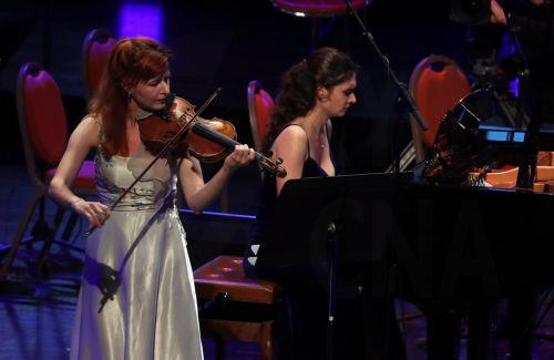 epa12045724 The Czech musical duo Ludmila Pavlova (L) and Marie Sumnikova (R) perform during the 14th International Cultural Festival of Symphonic Music at the Algiers Opera, in Algiers, Algeria, 21 April 2025. The 14th International Cultural Festival of Symphonic Music will be held from 17 to 23 April. Seventeen countries will participate, including...
