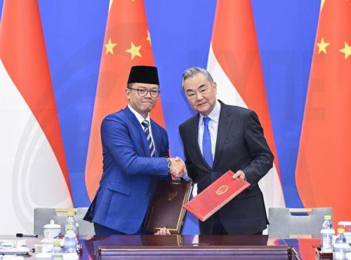 epa12045811 China's Foreign Minister Wang Yi and Indonesia's Foreign Minister Sugiono shake hands after signing a memorandum of understanding on establishing a comprehensive strategic dialogue mechanism between the Chinese and Indonesian governments after the First Ministerial Meeting of China-Indonesia Joint Foreign and Defense Ministerial Dialogue in...