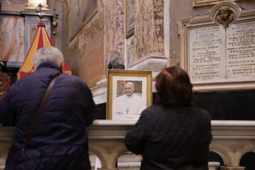 epa12045861 People pray in front of an image of Pope Francis at the Basilica of San Jose de Flores in Buenos Aires, Argentina, 21 April 2025. Pope Francis died on 21 April 2025 at the age of 88, according to the Holy See. Born Jorge Mario Bergoglio in Buenos Aires, Argentina. On 17 December 1936, he was appointed leader of the Catholic Church on 13 March...