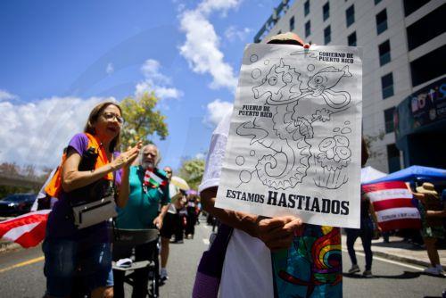 epa12047909 People protest against the construction permits near the beaches in San Juan, Puerto Rico, 22 April 2025. Several environmental organizations gathered to protest against construction permits in the vicinity of the beaches, which cause erosion on the coasts, disruption of the environment, and pollution, as part of International Earth Day. ...