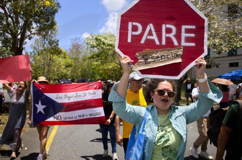 epa12047911 People protest against construction permits near the beaches in San Juan, Puerto Rico, 22 April 2025. Several environmental organizations gathered to protest against construction permits in the vicinity of the beaches, which cause erosion on the coasts, disruption of the environment, and pollution, as part of International Earth Day.  EPA/Thais...