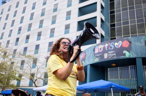 epa12047912 A woman protests against the construction permits near the beaches in San Juan, Puerto Rico, 22 April 2025. Several environmental organizations gathered to protest against construction permits in the vicinity of the beaches, which cause erosion on the coasts, disruption of the environment, and pollution, as part of International Earth Day. ...