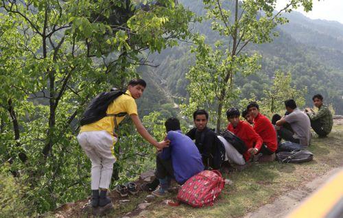 epa12069241 Kashmiri students take a rest at Tilawari village of Uri sector, along the Line of Control (LoC) in Baramulla, Indian-administered Kashmir, 02 May 2025. Security has been built up along the LoC, the de facto border that separates Kashmir into Indian and Pakistani administered parts, after at least 26 people were killed on 22 April when gunmen...