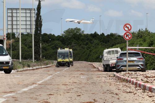 epa12072583 An airplane takes off as damage caused by a ballistic missile fired from Yemen is seen at the Ben Gurion airport near Tel Aviv, Israel, 04 May 2025. According to Israel's military spokesperson, a ballistic missile fired from Yemen hit at the Ben Gurion airport. Yemen's Houthis have claimed responsibility for launching the missile.  EPA/ABIR...