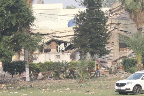 epa12079123 Rescue workers work at the building that was targeted in an Indian missile strike near Muridke, Punjab province, Pakistan, 07 May 2025. The Indian government said it conducted military strikes on nine sites in Pakistan in retaliation for a deadly militant attack on tourists in Kashmir.  EPA/RAHAT DAR
