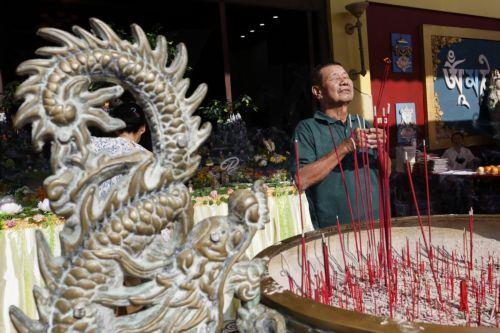 epa12092963 A man takes part in Vesak Day or Buddha's Birthday, celebrations at a temple in Denpasar, Bali, Indonesia, 12 May 2025. Buddhists celebrate Vesak Day to mark the date of the birth, enlightenment, and passing of Gautama Buddha (Siddhartha Gautama).  EPA/MADE NAGI