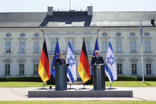 epa12093420 German President Frank-Walter Steinmeier (R) and Israeli President Isaac Herzog give a news conference in front of Bellevue Palace in Berlin, Germany, 12 May 2025. Herzog is visiting Berlin to mark 60 years of diplomatic relations between the two countries.  EPA/HANNIBAL HANSCHKE
