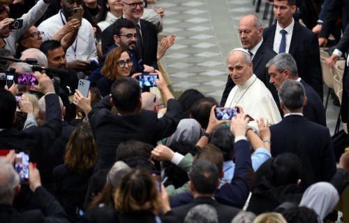epa12093684 Pope Leo XIV (C) leaves after an audience with members of the media at the Paul VI Audience Hall in Vatican City, 12 May 2025.  EPA/ETTORE FERRARI