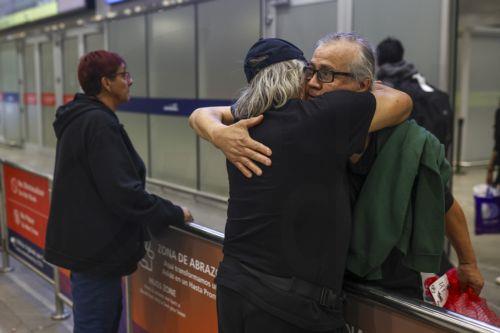 epa12127519 A Chilean migrant (R) is welcomed upon his arrival at Arturo Merino Benitez International Airport in Santiago de Chile, Chile, 23 May 2025. Authorities confirmed that 45 Chilean citizens arrived from the United States after being deported under new immigration guidelines pushed by Donald Trump's administration, which has intensified expulsion...