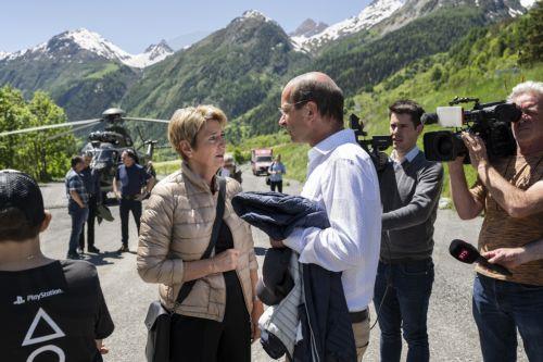 epa12144926 Swiss Federal President Karin Keller-Sutter (L) is welcomed by Beat Rieder, member of the Swiss Council of States of the Canton of Valais, before inspecting the damage caused by the catastrophic landslide destroying the village of Blatten, in Wiler, Switzerland, 30 May 2025. A large part of the Blatten village, located in the Loetschental Valley...