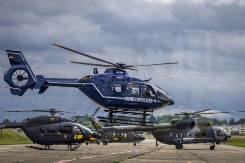 epa12151018 Helicopters of the German Bundespolizei (top), the Lithuania Air Force, Swiss Air Force, and the Czech Air Force (L-R) take off during an international air radiometry exercise on the Duebendorf Military Air Base, in Duebendorf, Switzerland, 02 June 2025. Specialists from France, Germany, the Czech Republic, Lithuania and Switzerland are taking...