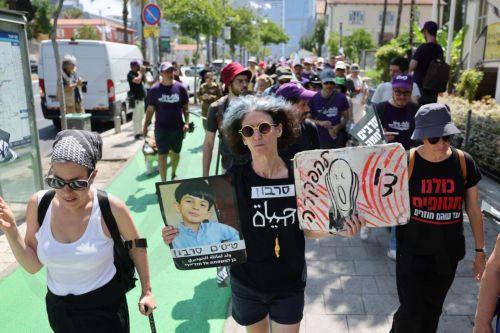 epaselect epa12154336 Israeli activists gather for the start of a three-day march calling for an end to the war in Gaza and the release of hostages, in Tel Aviv, Israel, 04 June 2025. Organizers said the march will conclude at the Gaza border on 06 June.  EPA/ABIR SULTAN EPA